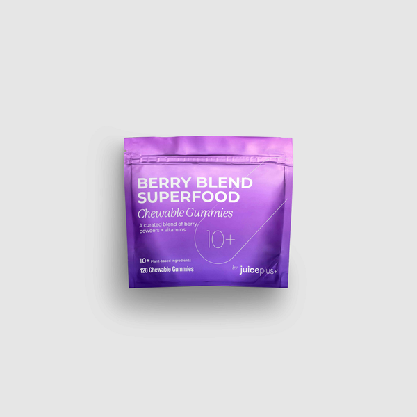 Purple package of Berry Blend Superfood Chewable Gummies on a light gray background