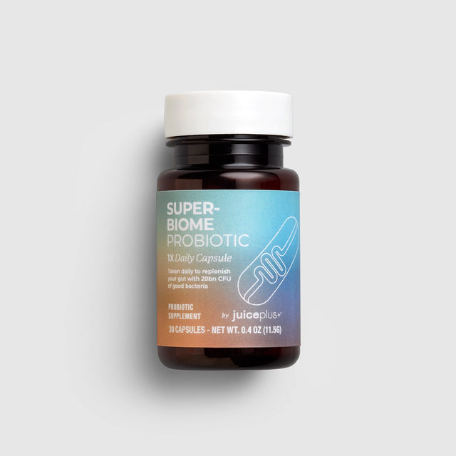 Super-Biome Probiotic bottle by Juice Plus+ on a light gray background